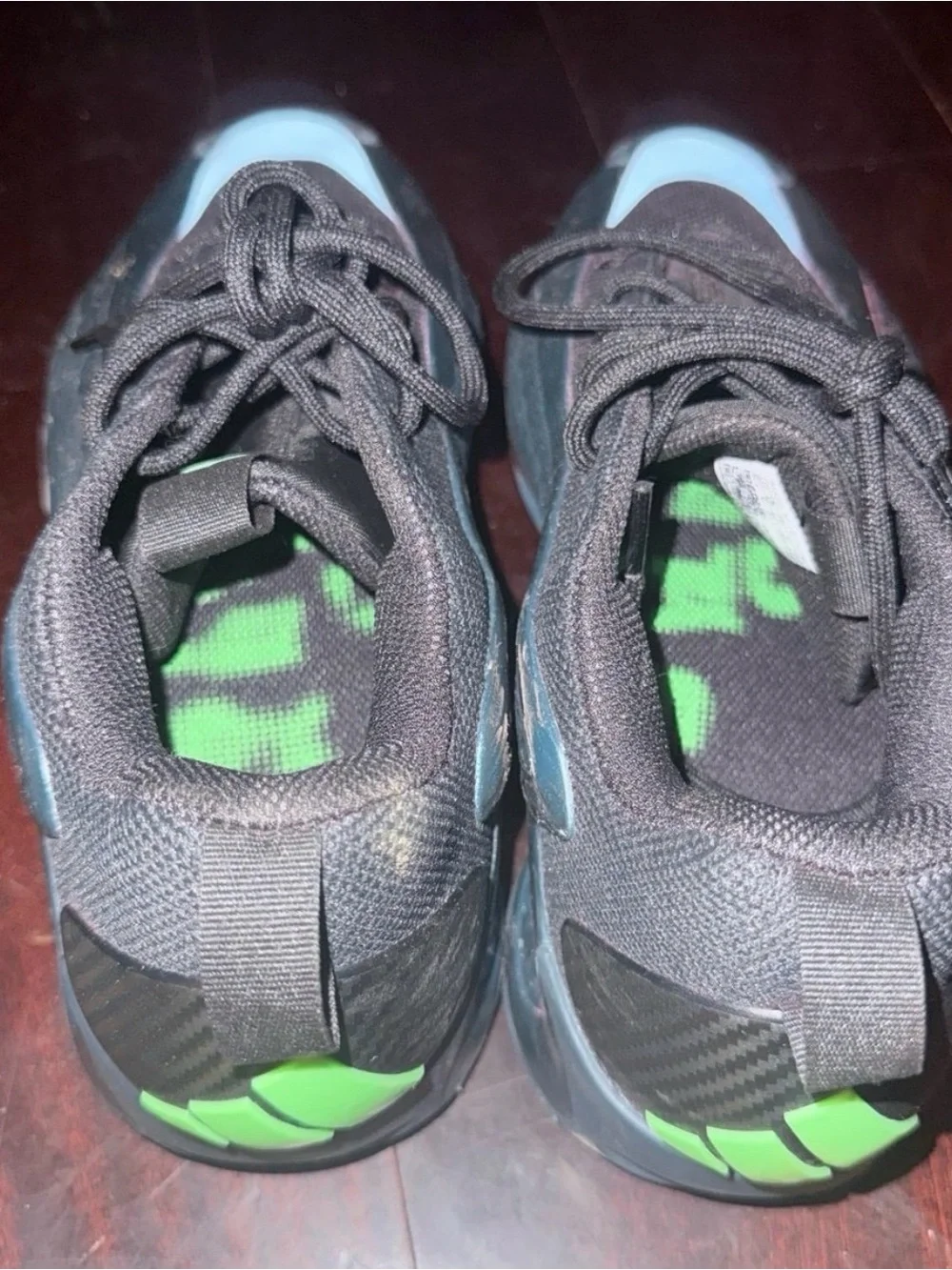 adidas Men's Black Sneaker with Iridescent Teal Accent
